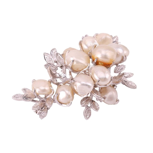 40 - A pearl-set spray brooch, claw-set with twelve baroque pearls in a branching foliate mount, one ston... 