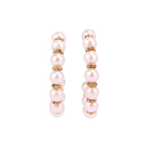 43 - A Mikimoto cultured pearl choker and a pair of matching earrings; the choker comprising five rows of... 