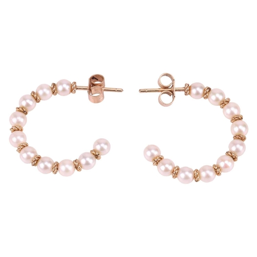 43 - A Mikimoto cultured pearl choker and a pair of matching earrings; the choker comprising five rows of... 