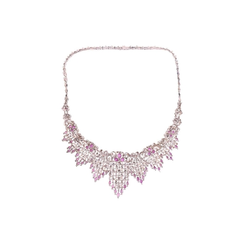 60 - A pink sapphire and diamond parure comprising a necklace, a bracelet, a ring and a pair of pendant e... 