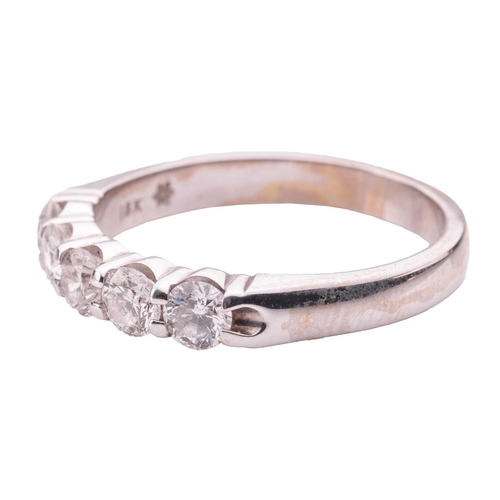 69 - A diamond five-stone ring in 18ct white gold, set with five brilliant-cut diamonds of 3.4 mm, with a... 