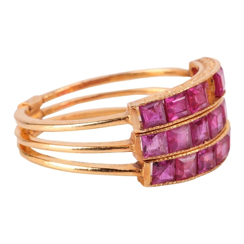 71 - A ruby-set Harem ring, comprising three flat bands adjoined at the base, each channel-set with a row... 