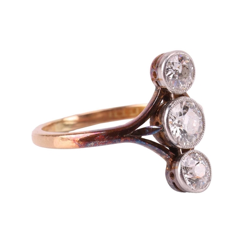 73 - A diamond trilogy ring, vertically set with three graduated old-cut diamonds in millgrained mounts, ... 