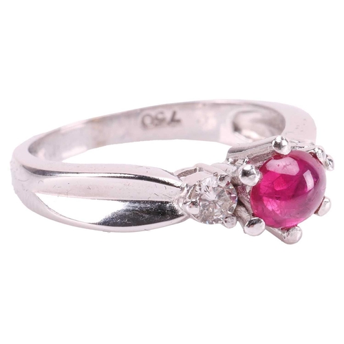 86 - A ruby cabochon and diamond dress ring, centred with an oval ruby cabochon of 5.9 x 5.0 x 2.8 mm, in... 