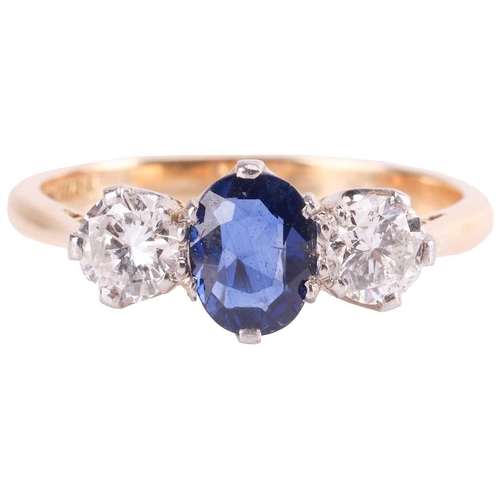 9 - A sapphire and diamond three-stone ring, centred with an oval-cut sapphire of 6.2 x 5.0 x 2.1 mm, cl... 