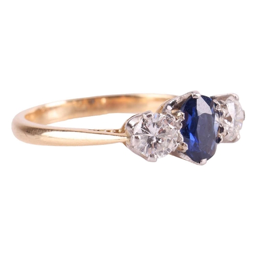 9 - A sapphire and diamond three-stone ring, centred with an oval-cut sapphire of 6.2 x 5.0 x 2.1 mm, cl... 