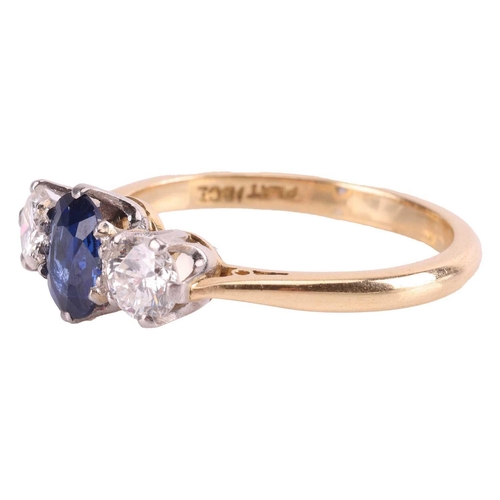 9 - A sapphire and diamond three-stone ring, centred with an oval-cut sapphire of 6.2 x 5.0 x 2.1 mm, cl... 