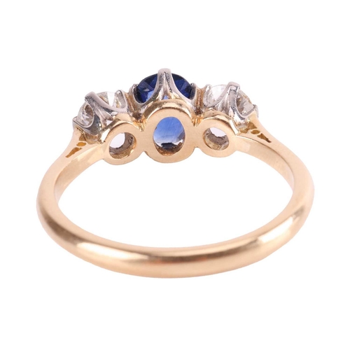 9 - A sapphire and diamond three-stone ring, centred with an oval-cut sapphire of 6.2 x 5.0 x 2.1 mm, cl... 