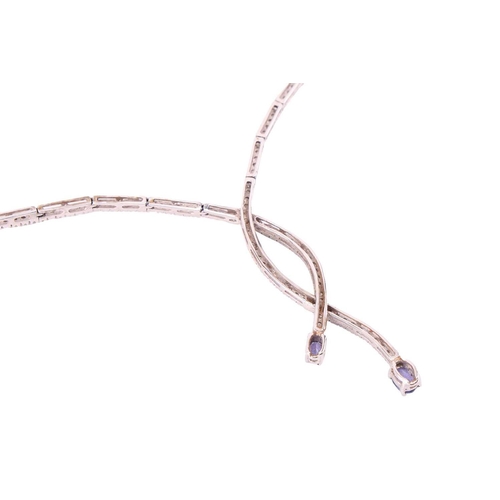 93 - A necklace set with diamond and tanzanite, of sinuous design, comprising a series of articulated bar... 