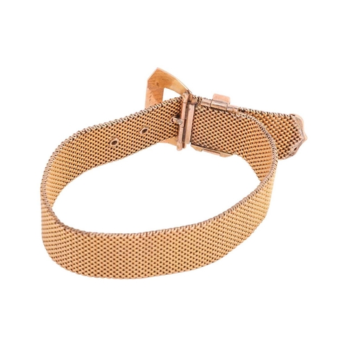 98 - A jarretière slide bracelet with buckle and mordant design, the woven mesh band completed with a buc... 