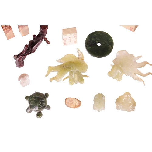 118 - A small collection of Chinese decorative jade and other stone carvings, including two jade fan tail ... 