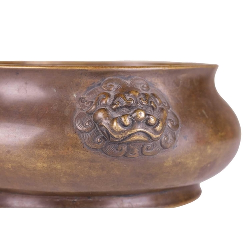 63 - A Chinese Ming Dynasty style patinated bronze censer, of low ogee moulded outline, possibly 18th cen... 