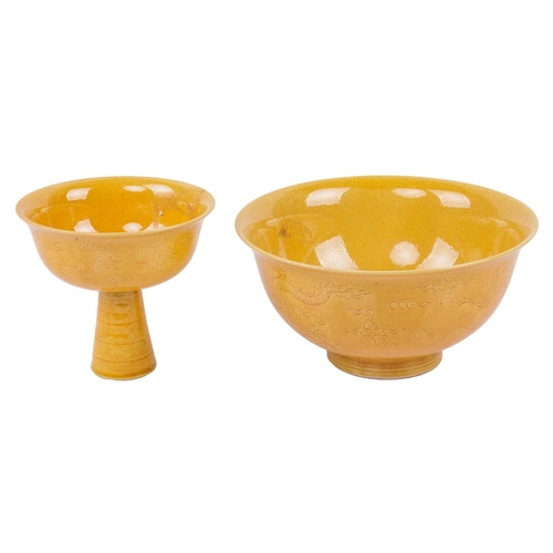 74 - A Chinese Yellow glazed porcelain stem cup, 20th century, decorated with incised five-clawed dragons... 