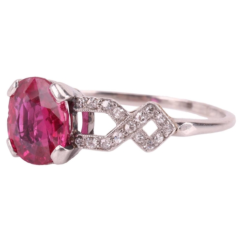 103 - An Edwardian ruby and diamond dress ring, centred with an oval-cut ruby of 8.0 x 7.2 x 3.2 mm, claw-... 