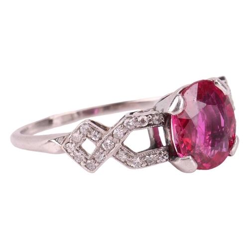 103 - An Edwardian ruby and diamond dress ring, centred with an oval-cut ruby of 8.0 x 7.2 x 3.2 mm, claw-... 