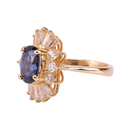 112 - A sapphire and diamond ballerina ring, centred with an oval-cut sapphire of 7.8 x 5.5 mm, claw-set w... 