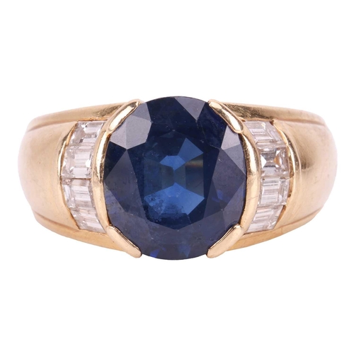 119 - A sapphire and diamond dress ring, consisting of an oval-cut sapphire of 10.2 x 8.8 x 5.4 mm, set be... 