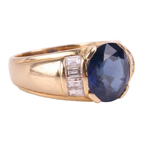 119 - A sapphire and diamond dress ring, consisting of an oval-cut sapphire of 10.2 x 8.8 x 5.4 mm, set be... 