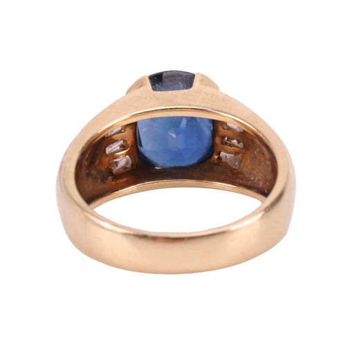 119 - A sapphire and diamond dress ring, consisting of an oval-cut sapphire of 10.2 x 8.8 x 5.4 mm, set be... 