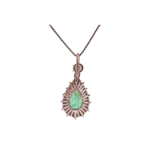 121 - An emerald and diamond cluster pendant on chain, centred with a pear-cut emerald of 9.3 x 6.9 x 3.4 ... 