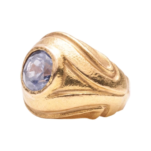 125 - A sapphire dress ring, centred with an oval-cut sapphire in pale purplish-blue, approximately measur... 