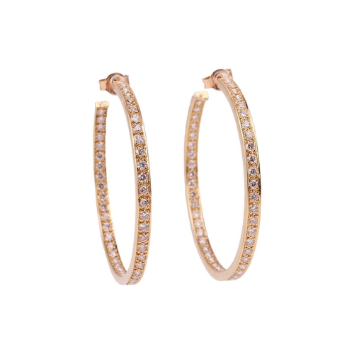 126 - A pair of diamond-set hoop earrings, grain-set with ninety-four round brilliant diamonds along the f... 