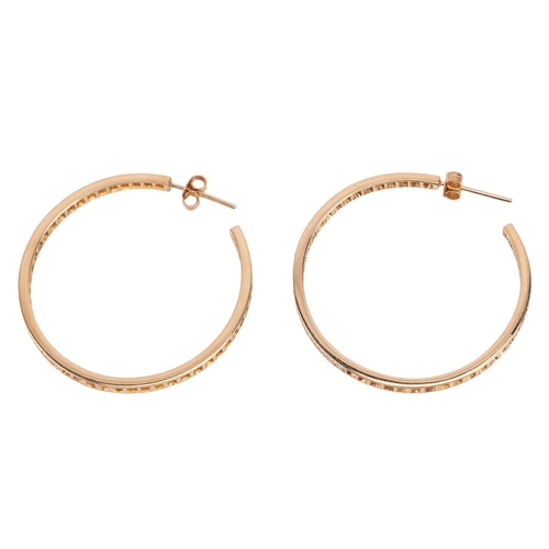 126 - A pair of diamond-set hoop earrings, grain-set with ninety-four round brilliant diamonds along the f... 