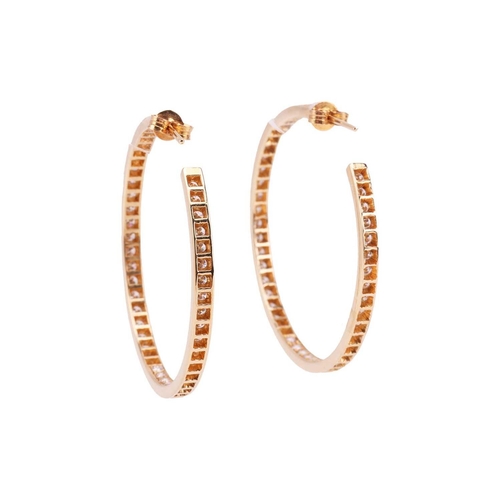 126 - A pair of diamond-set hoop earrings, grain-set with ninety-four round brilliant diamonds along the f... 