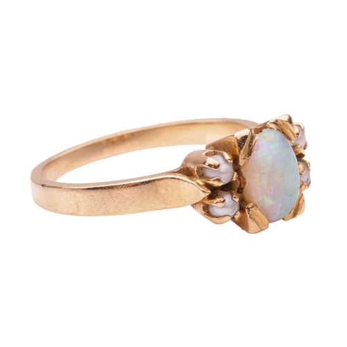 131 - An opal and seed pearl dress ring, featuring an opal cabochon measuring approximately 6.8mm x 5.2mm,... 