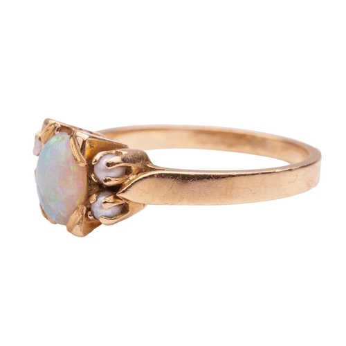 131 - An opal and seed pearl dress ring, featuring an opal cabochon measuring approximately 6.8mm x 5.2mm,... 