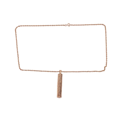 132 - A 9ct gold log pendant on chain, the pendant in the form of a piece of log with bark effect finish, ... 