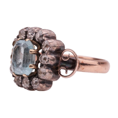 141 - A Victorian aquamarine and diamond cluster ring, centred with an octagonal-cut aquamarine of 7.5 x 6... 