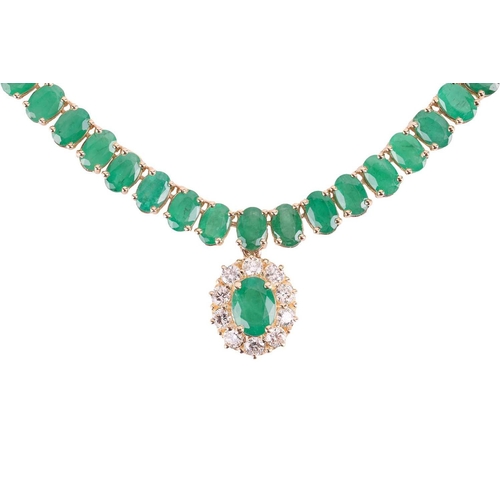 145 - An emerald and diamond necklace, composed of ninety six oval mixed-cut emeralds in a line of articul... 