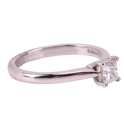 147 - A diamond solitaire ring in 18ct white gold, claw-set with a princess-cut diamond with an estimated ... 