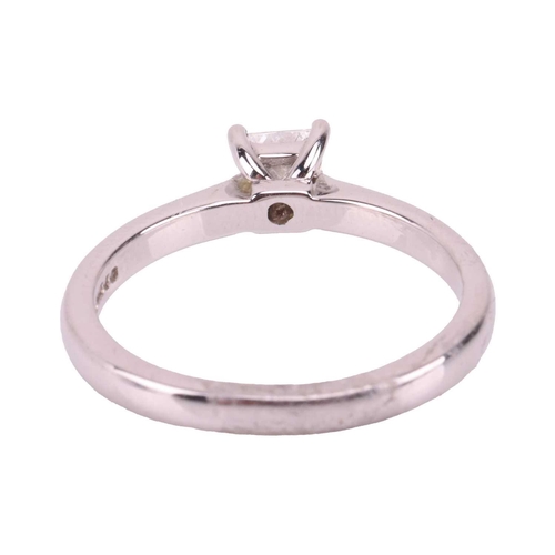 147 - A diamond solitaire ring in 18ct white gold, claw-set with a princess-cut diamond with an estimated ... 