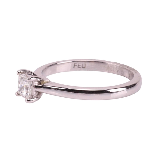 147 - A diamond solitaire ring in 18ct white gold, claw-set with a princess-cut diamond with an estimated ... 