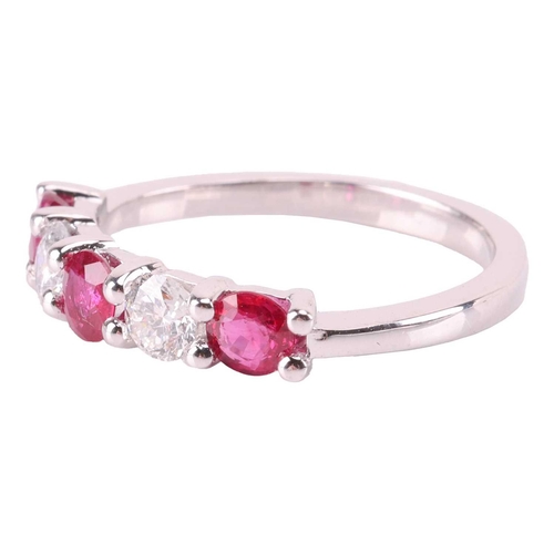 149 - A ruby and diamond five-stone ring, featuring two round brilliant diamonds set between three round-c... 