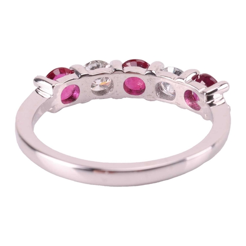 149 - A ruby and diamond five-stone ring, featuring two round brilliant diamonds set between three round-c... 