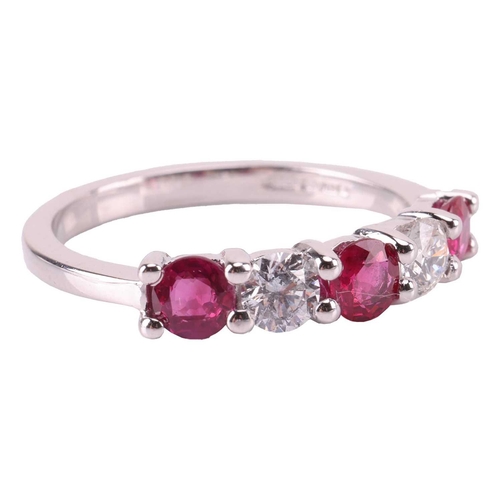 149 - A ruby and diamond five-stone ring, featuring two round brilliant diamonds set between three round-c... 