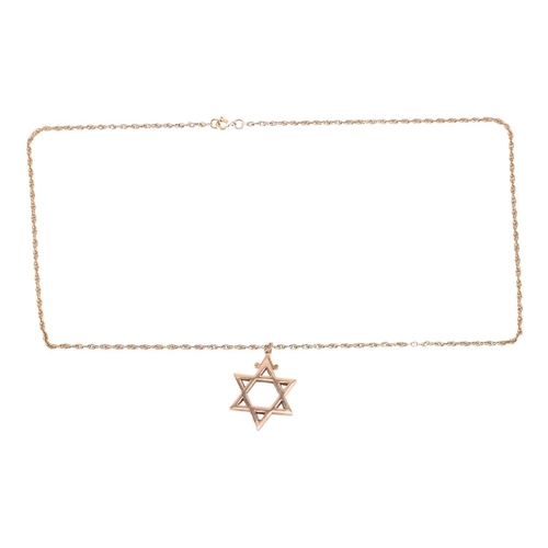 152 - A Star of David pendant on chain, the solid pendant struck with London assay marks and measures 3.9 ... 