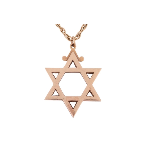 152 - A Star of David pendant on chain, the solid pendant struck with London assay marks and measures 3.9 ... 