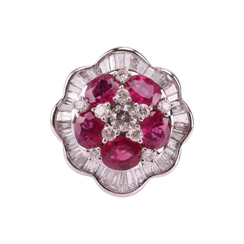 158 - A ruby and diamond ballerina ring the central brilliant-cut diamond cluster highlighted by six oval-... 