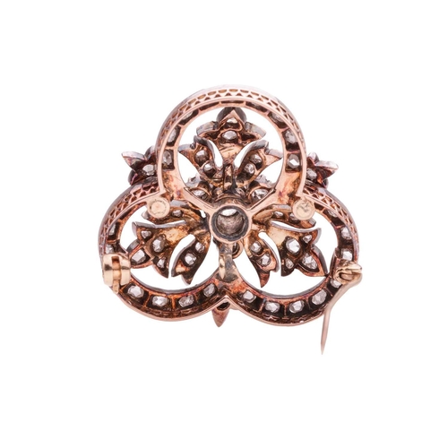 161 - An Edwardian diamond-set brooch, centred with an old-cut diamond cluster, encircled by foliate motif... 