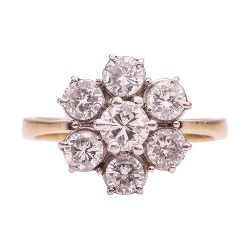 162 - A diamond-set floral cluster ring, claw-set with seven round brilliant diamonds, the central diamond... 