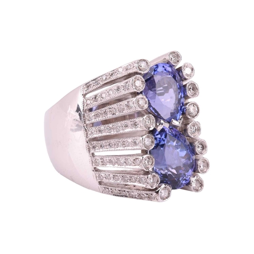 169 - A tanzanite and diamond cocktail ring, centrally claw-set with two pear-cut tanzanites, approximatel... 