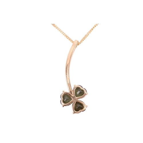 177 - An Irish shamrock pendant on chain, the trefoil motif is composed of three heart-cut tourmalines, on... 