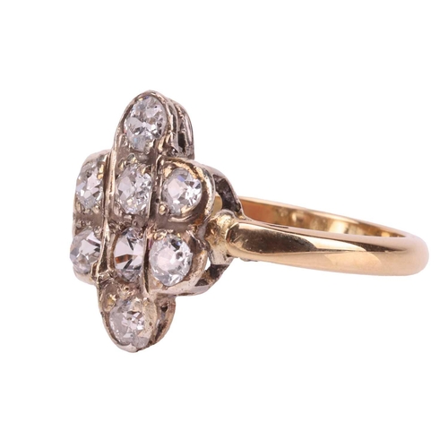 187 - A diamond-set dress ring, the plaque-style head featuring seven old-cut diamonds measuring approxima... 