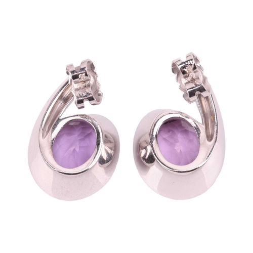 188 - Boodles - a pair of Sonata stud earrings set with amethyst and diamond, each composed of an oval-cut... 