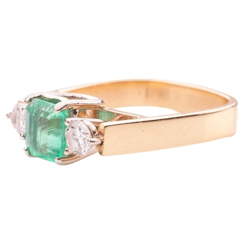 19 - A modern emerald and diamond trilogy ring, comprising a step-cut emerald with canted corners, of bri... 