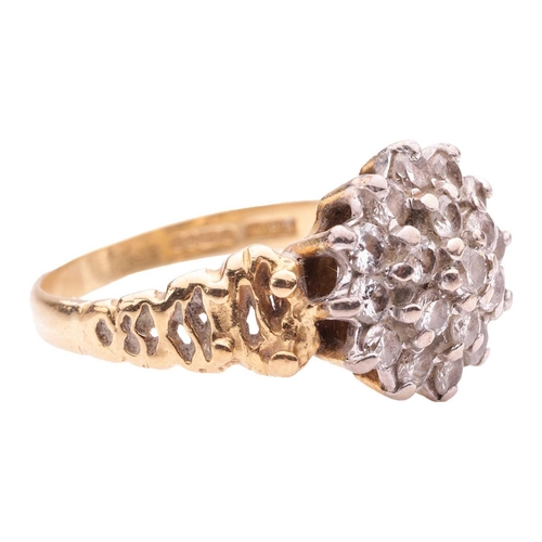 190 - A Modernist-style diamond cluster ring in 18ct gold, set with nineteen round brilliant-cut diamonds,... 